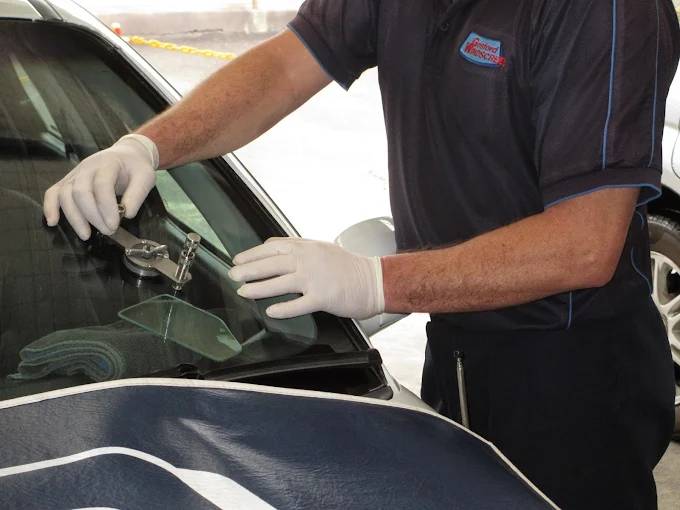 windshield repair technician fixing a crack at Gosford Windscreens