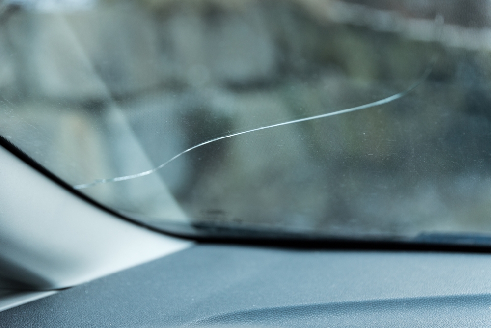 Small crack on car windscreen near dashboard at Gosford Windscreens.